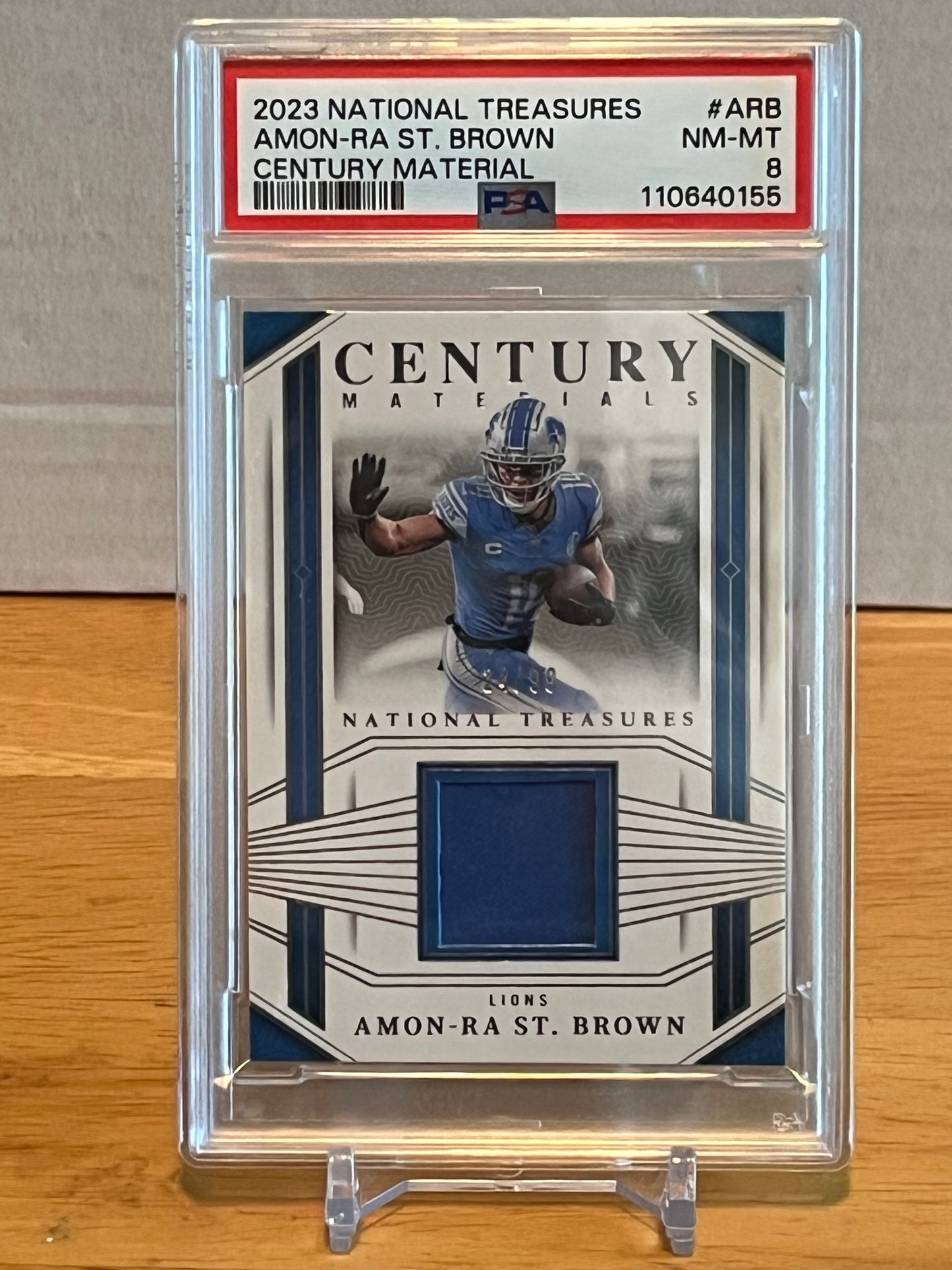 2023 Panini National Treasures Amon-Ra St. Brown Century Material PSA 8